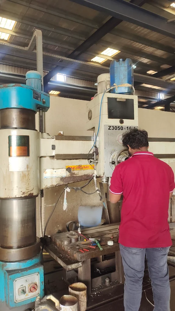 CNC machine technician servicing radial drill UAE